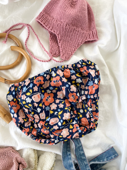 Håndstrikket rosa kyse str. 0-1 mdr