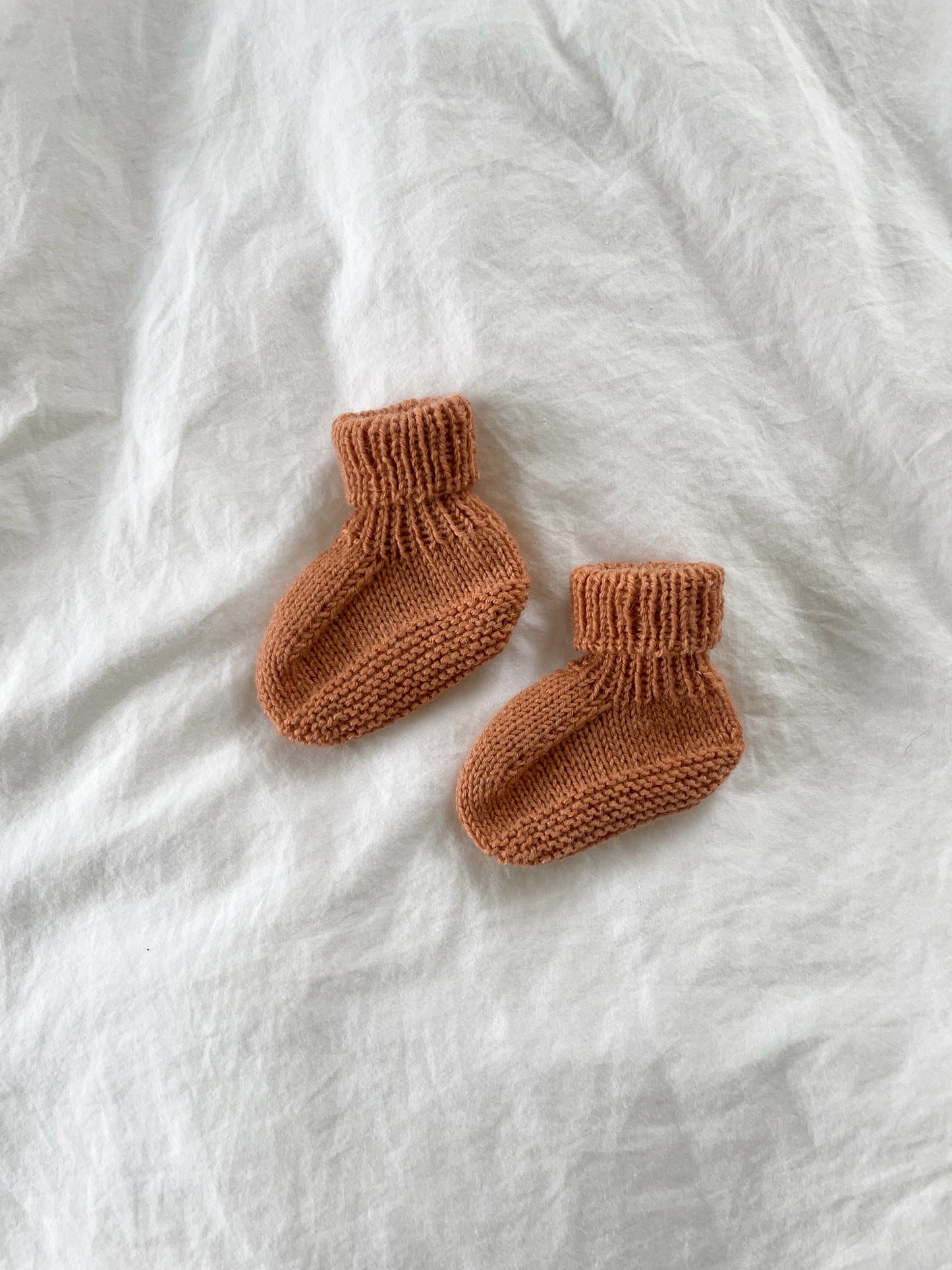 Håndstrikkede futter i Merino, Clay str. 0-2 mdr